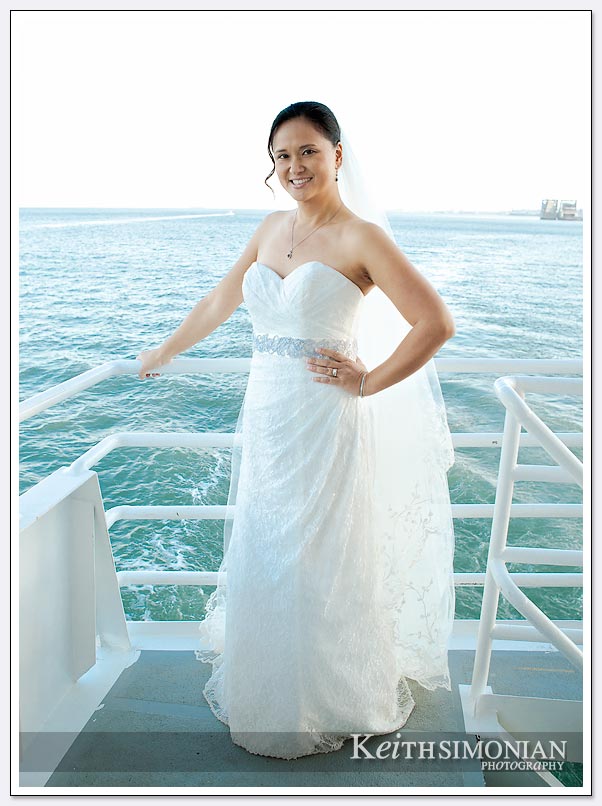 Bride poses on the deck of Commodore Cruise line