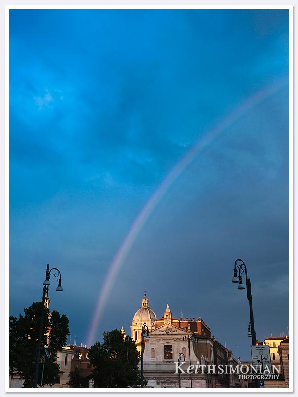The light rain and sunlight created a rainbow over Rome Italy