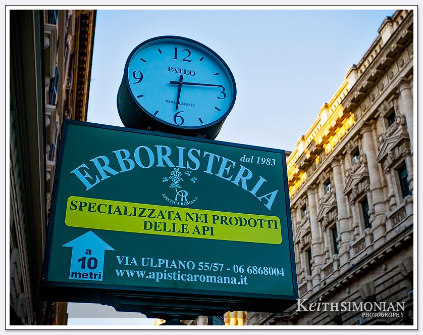The Erboristeria clock says the time is 6:15 AM