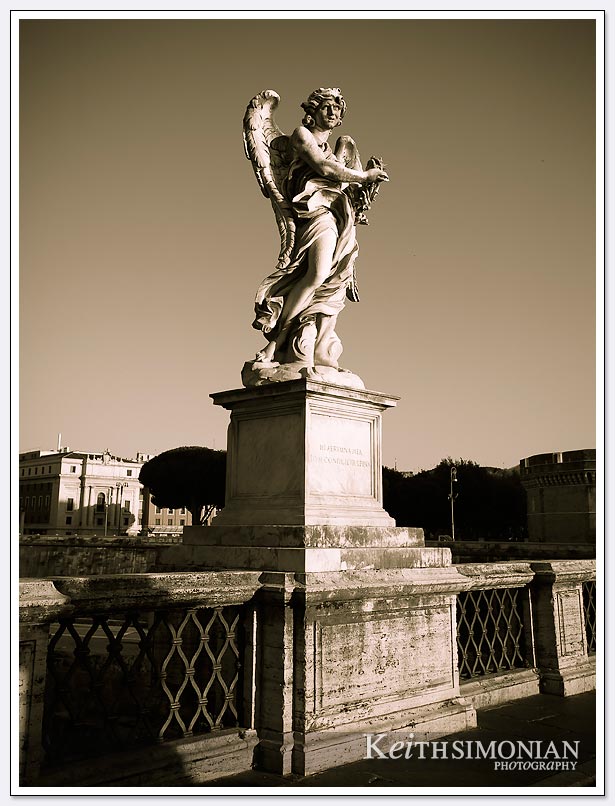 Statue on bridge over the fiume tevere.