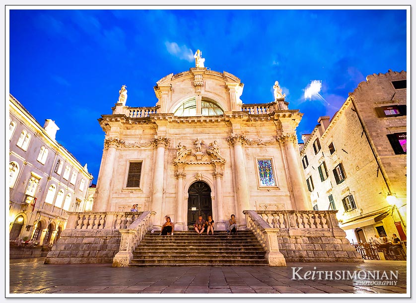 The blue night sky and tourists on one of the beautiful buildings in Dubrovnik, Croatia
