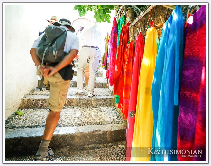 Climb up the stairs past the tourist shops to the Acropolis of Lindos