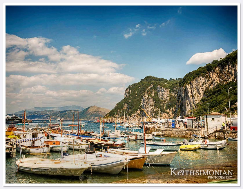 Port of Capri, Italy with many small sailing ships.