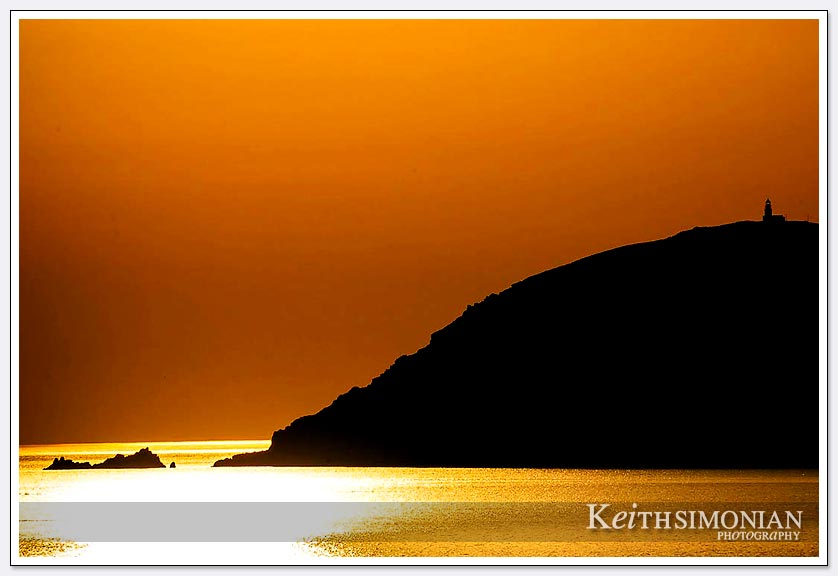 Lighthouse at sunrise in the Aegean Sea