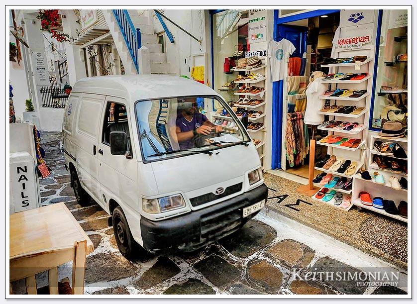 There are no roads in the old town of Mykonos, Greece so the deliveries are made by quite small trucks to the shops.