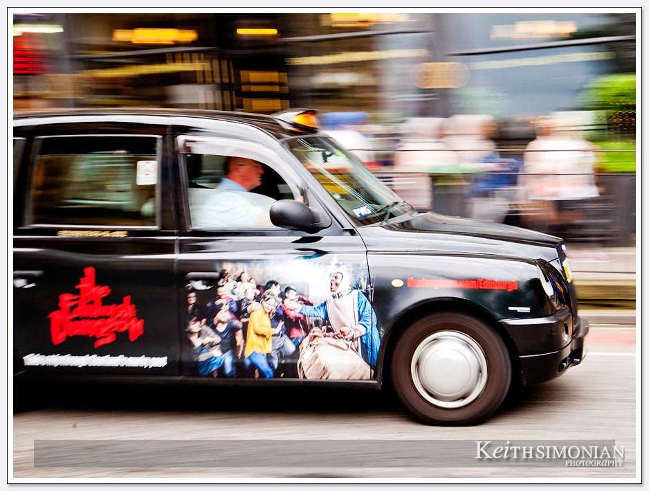 Ads adorn taxi cabs in Edinburgh Scotland
