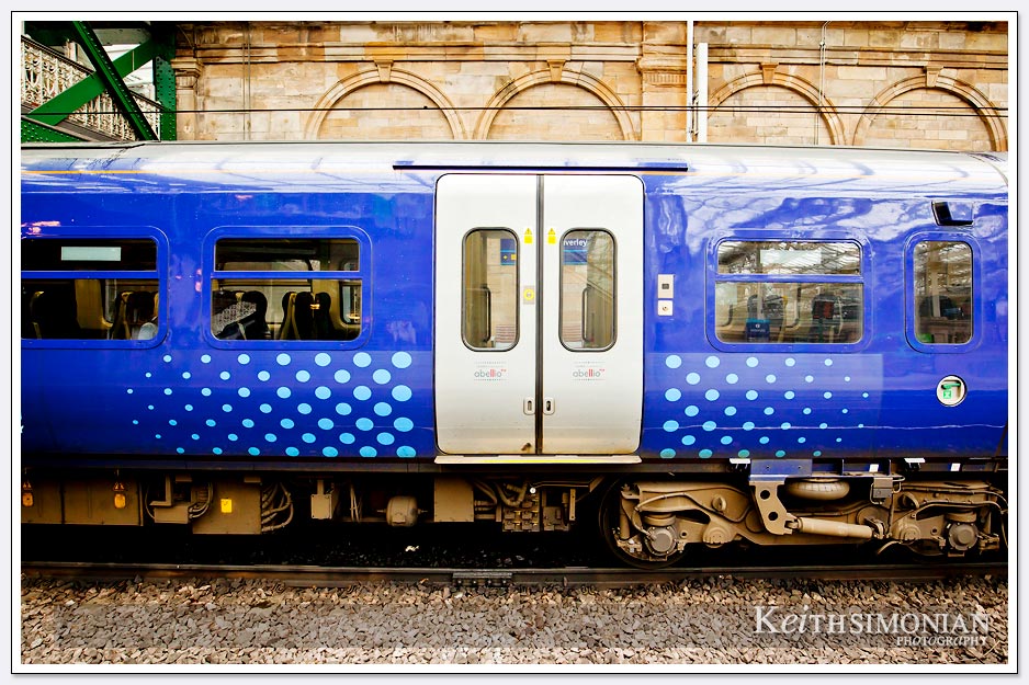 Blue railway car in the Edinburgh train station
