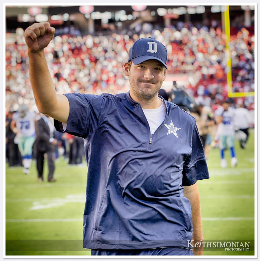 Dallas Cowboy Tony Romo fist pumps the crowd after the Cowboys beat the San Francisco 49ers in Levi's Stadium during their 2016 game.