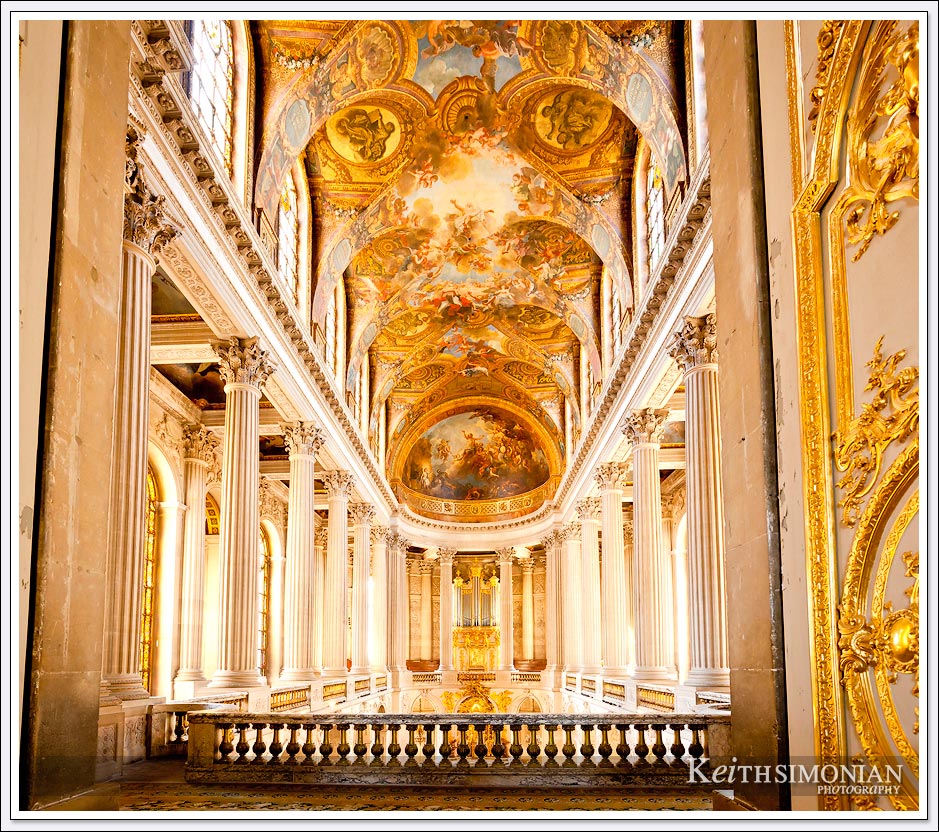 Amazing view of paintings and columns in the Palace of Versailles, France