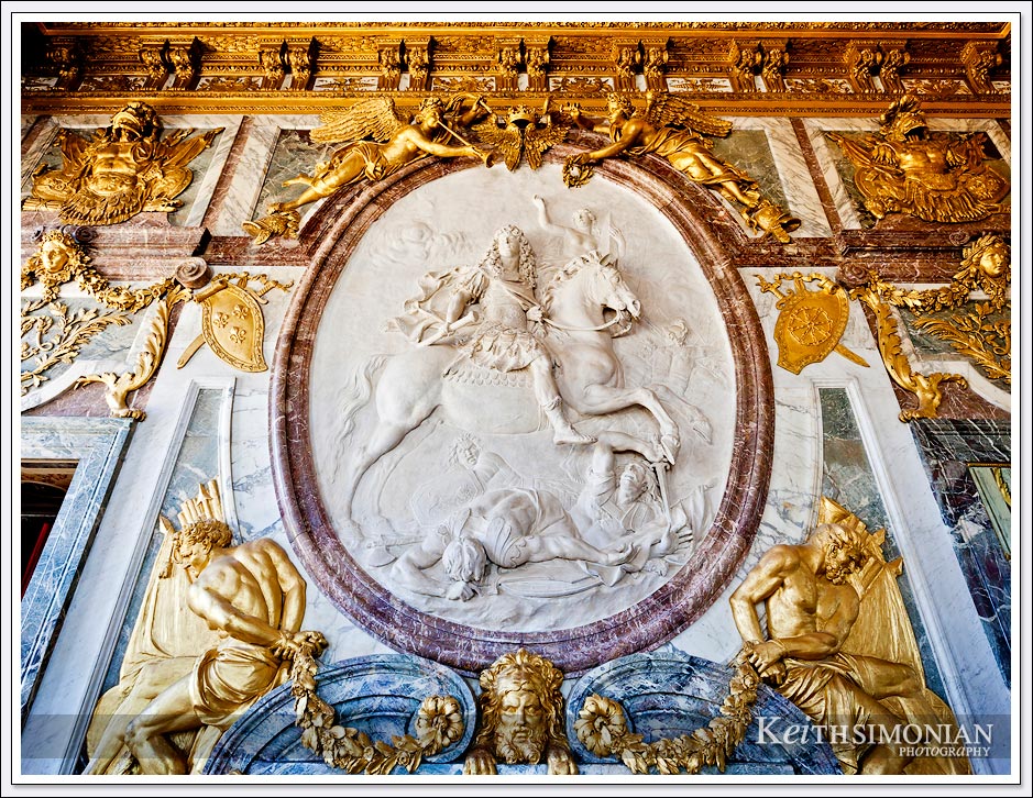 Gold and marble adorn the War Salon in the Palace of Versailles, France