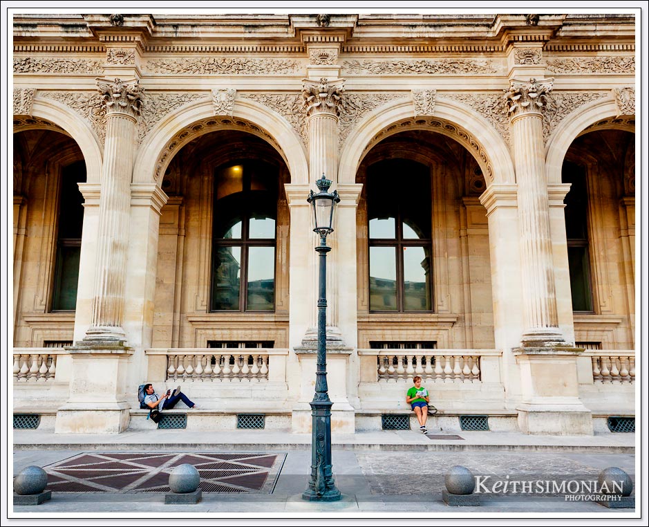 The courtyard of the Louvre in Paris France is a wonderful location to take a break and read a book.