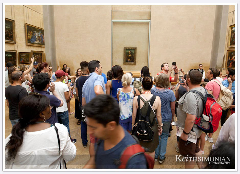 The crowds that are always present around the Mona Lisa painting in the Louvre - Paris France