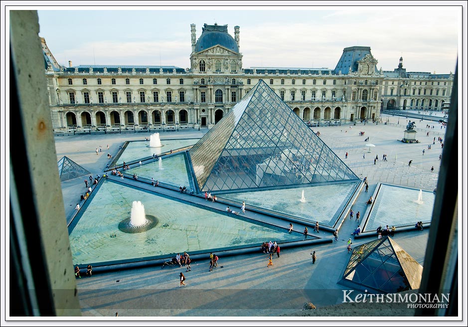 From the 2nd story of one of buildings that make up the Louvre museum you can see the glass pyramid that is the entrance to the complex.