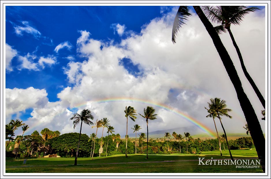 Clouds and a full rainbow just above the golf course at the Maui Hyatt Regency
