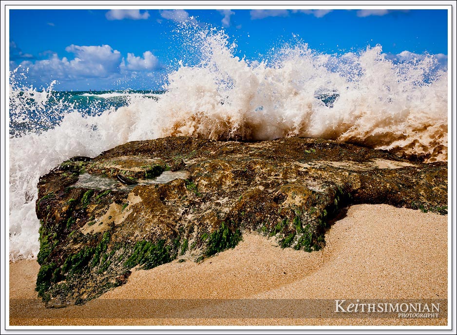 The water pulls back from the beach then comes crashing back on the rocks with all the power of nature.