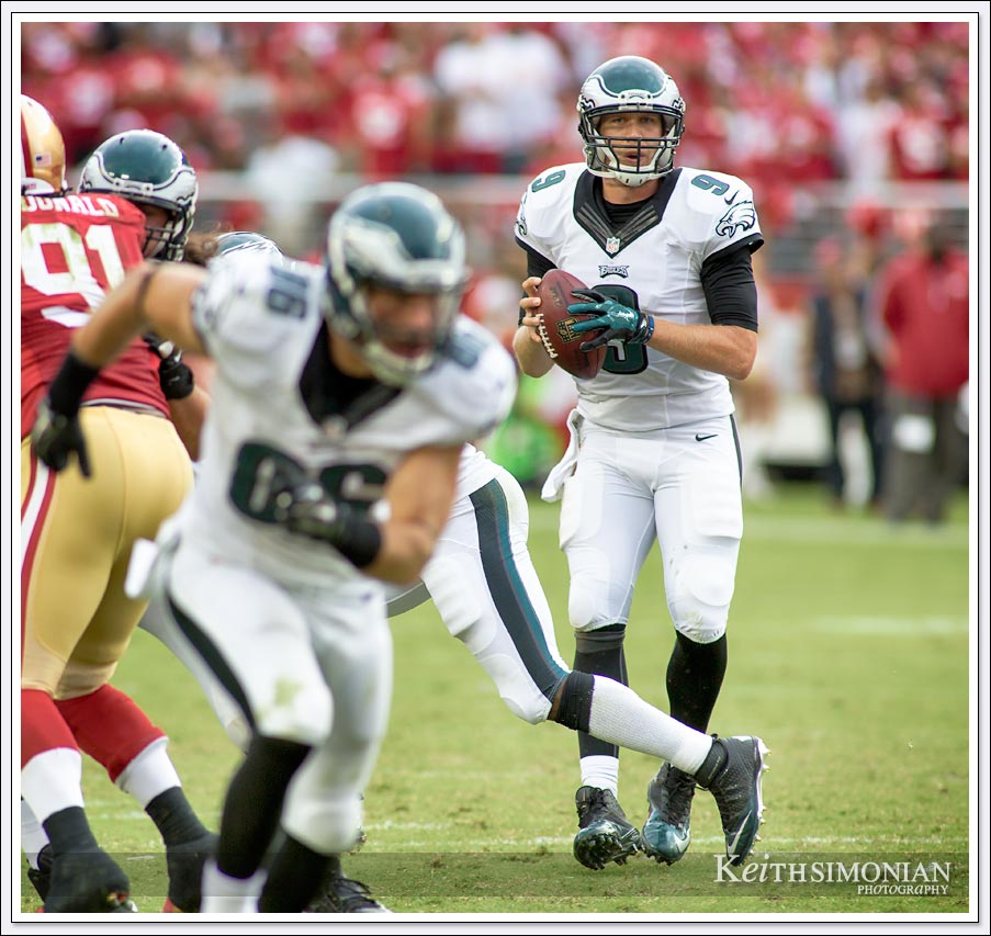 Philadelphia Eagles quarterback backs up in the pocket while looking for a receiver during this 2014 match up against the San Francisco 49ers in Levi's Stadium in Santa Clara.