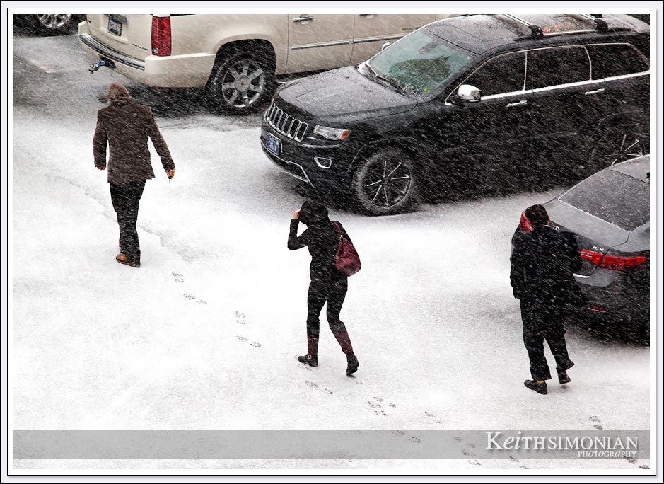 Hotel guests braving the snow to reach their cars in Reno, Nevada.