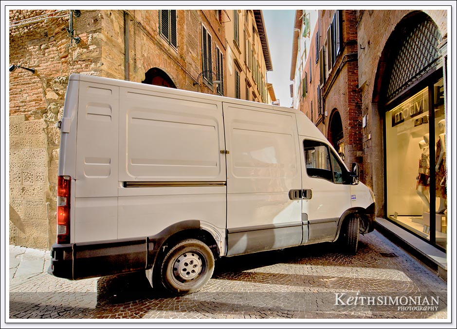 The street of Lucca, Italy weren't built oh so many years ago with modern day delivery trucks in mind.