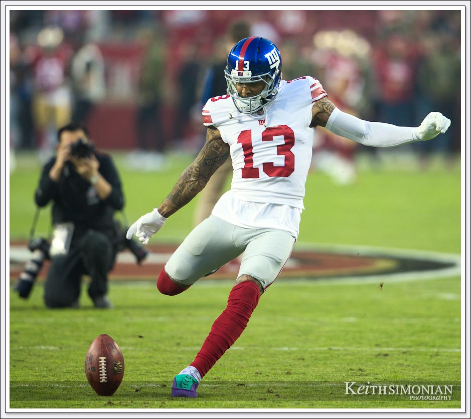 New York Giant Odell Beckham Jr. practices making a field goal during pre game warm ups.