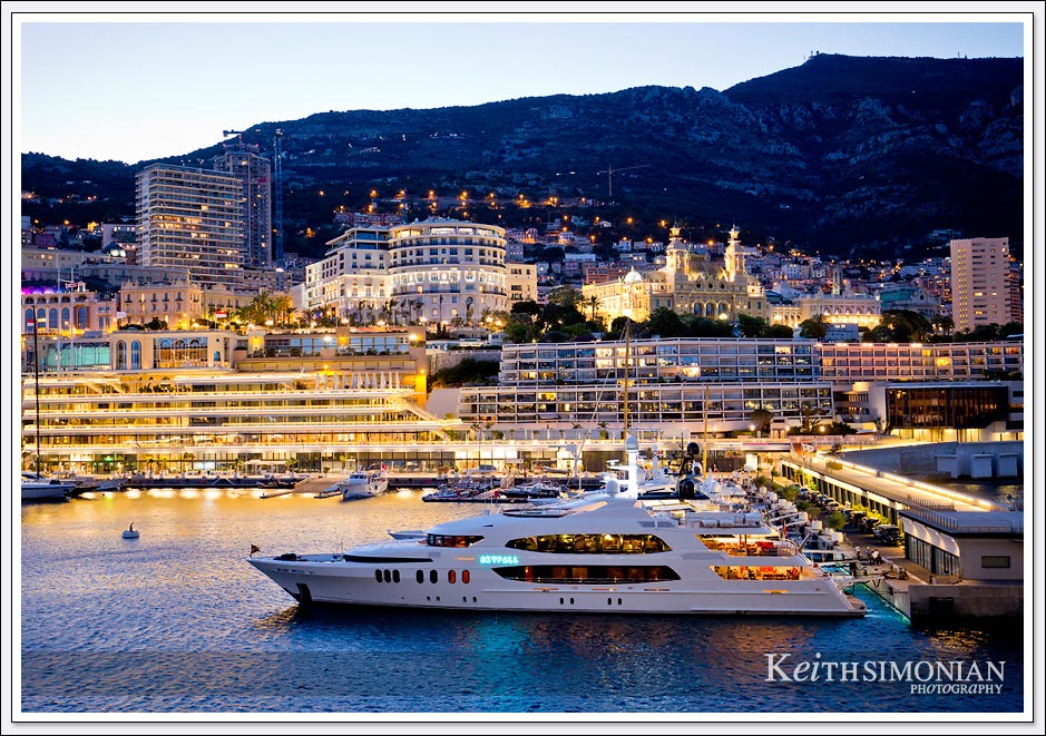 The 190 foot luxury yacht Skyfall is part of the elegance of Monte Carlo harbor at night.
