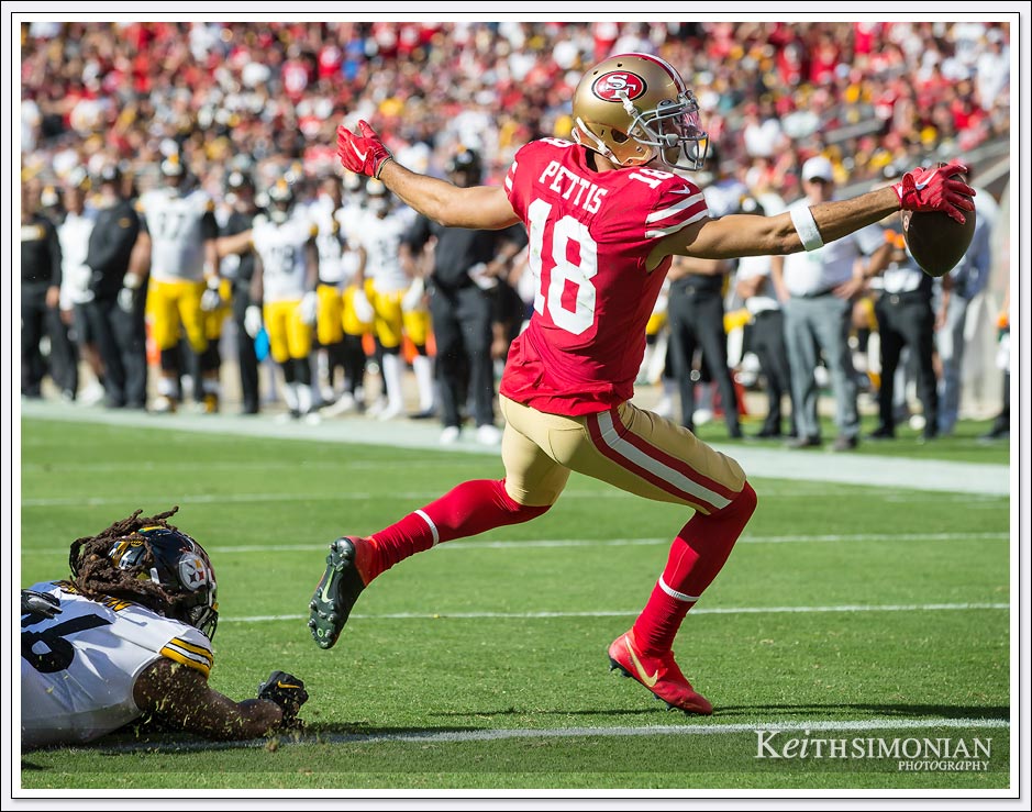 San Francisco 49er #18 Dante Pettis puts the ball across the goal line for the game winning touchdown against the Pittsburgh Steelers on September 22, 2019 at Levi's Stadium in Santa Clara, CA.