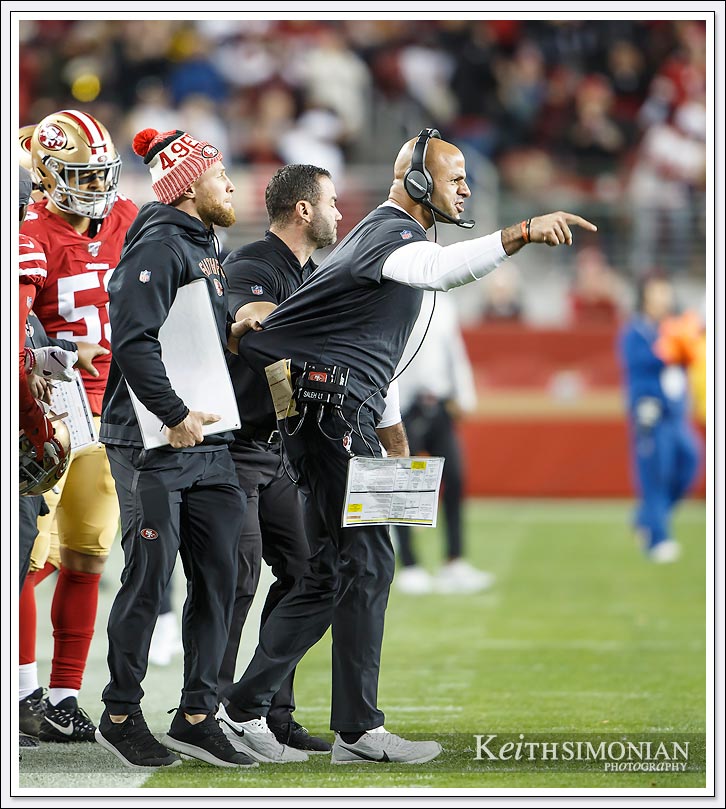 San Francisco 49er Defensive Coordinator Robert Saleh yells onto the field from the sidelines during the game against the Los Angeles Rams on December 21, 2019. 