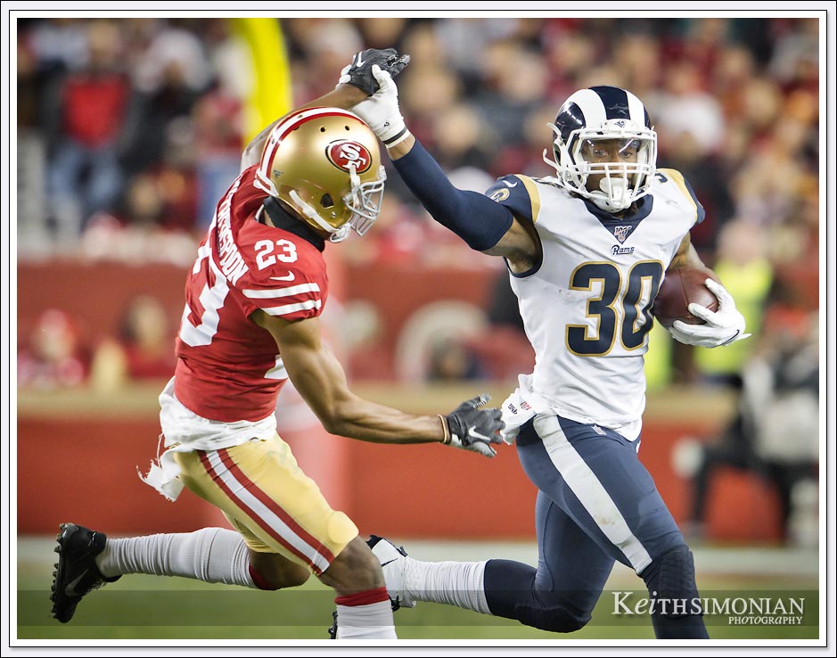 Los Angeles Rams half back #30 Todd Gurley II tries to break free for extra yards against San Francisco 49ers in Levi's Stadium on December 21, 2019. 