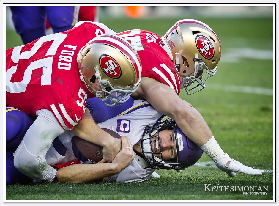 Minnesota Vikings quarterback Kirk Cousins is sacked by the San Francisco 49ers. 