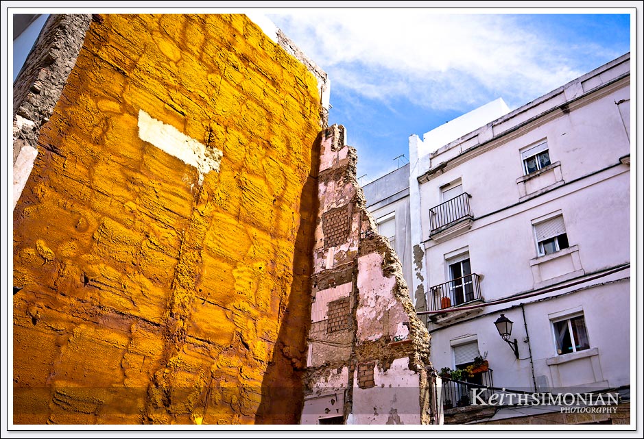 Yellow and white walls in the city of Cadiz Spain.