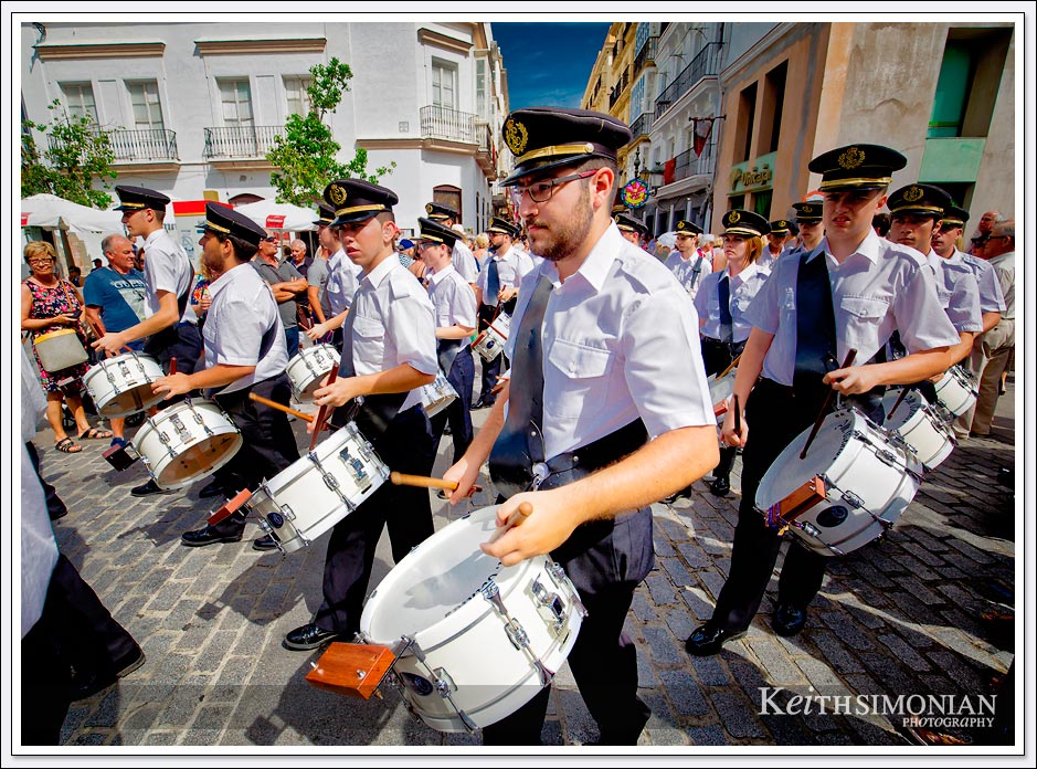 The drum core marches during the Corpus Christi Festival in Cadiz Spain. 