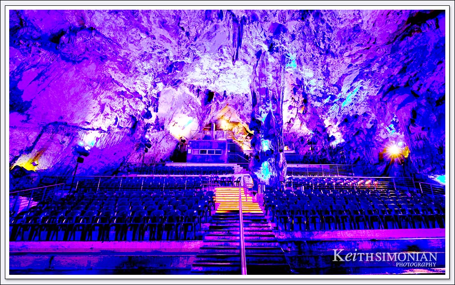 Purple lights color the seating inside the caves of the Rock of Gibraltar. 