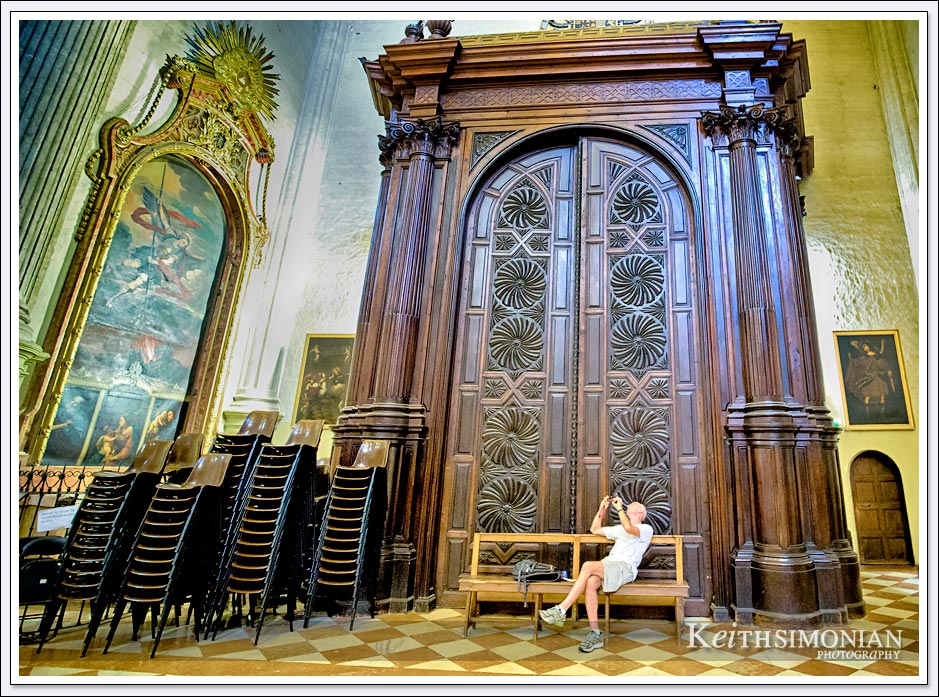 Visitor taking photo inside the Malaga Cathedral in Malaga Spain.