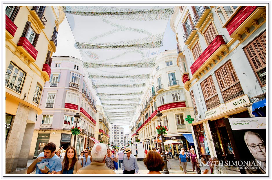 Shoppers walking along La Calle Larios - Malaga, Spain. Europe