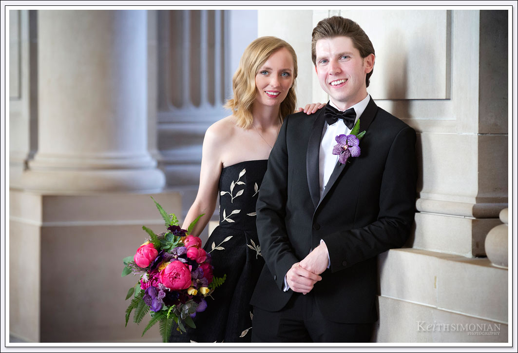 Both the bride and groom were decked out in black with bride in a black dress and the groom in a black tuxedo for the San Francisco city hall wedding.