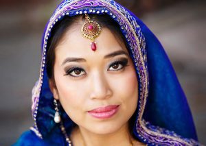 For this portrait the bride is wearing a purple veil.