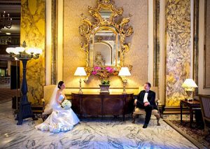 Bride and Groom in the elegant lobby of the Fairmont Hotel - San Francisco, CA