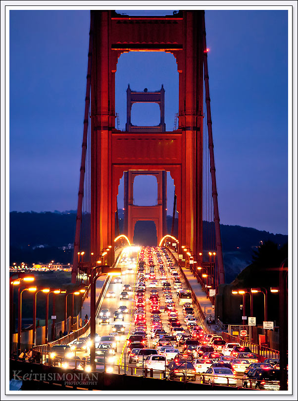 Hand held image of Golden Gate bridge rush hour traffic at twilight from the Marin side of the bridge.