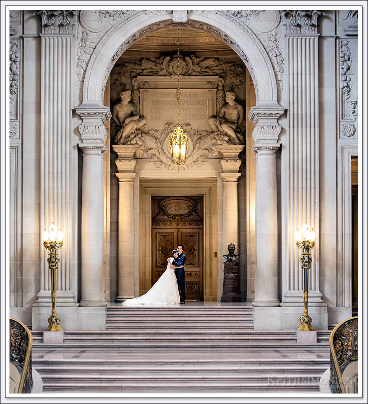 Bride and Groom pose in San Francisco City hall for wedding portraits