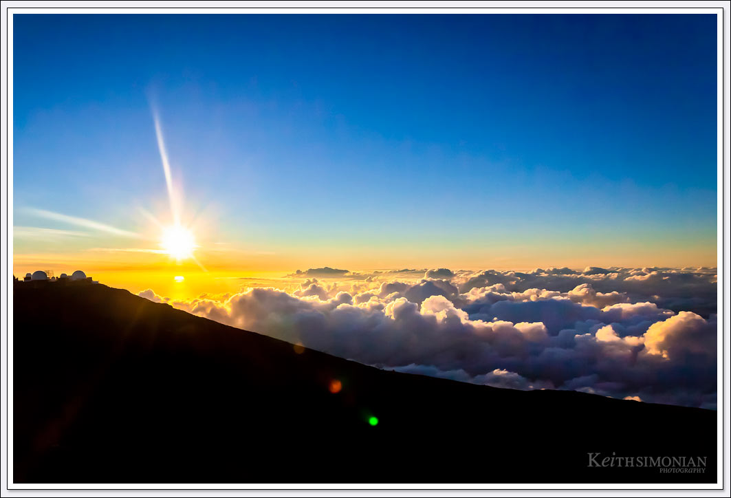 Viewing a sunset from above the clouds at the Haleakala Maui Summit. 