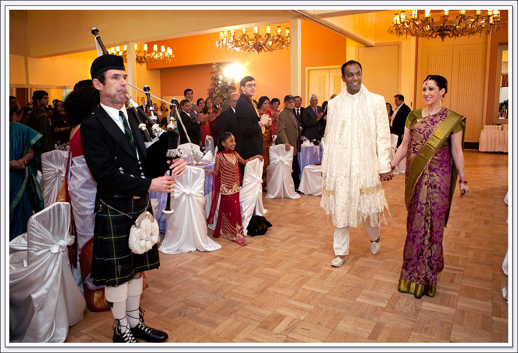 The bride and groom enter their wedding reception with bagpipes playing at Castlewood Country Club - Pleasanton, CA.