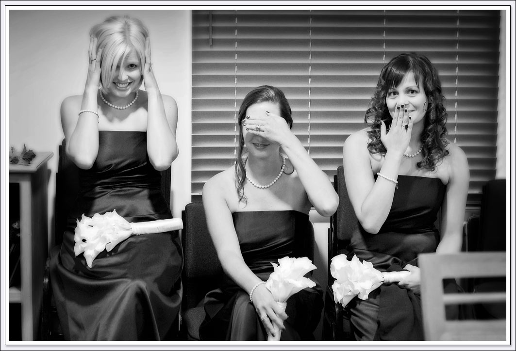 Bridesmaids pose for a goofy photo while getting ready for wedding