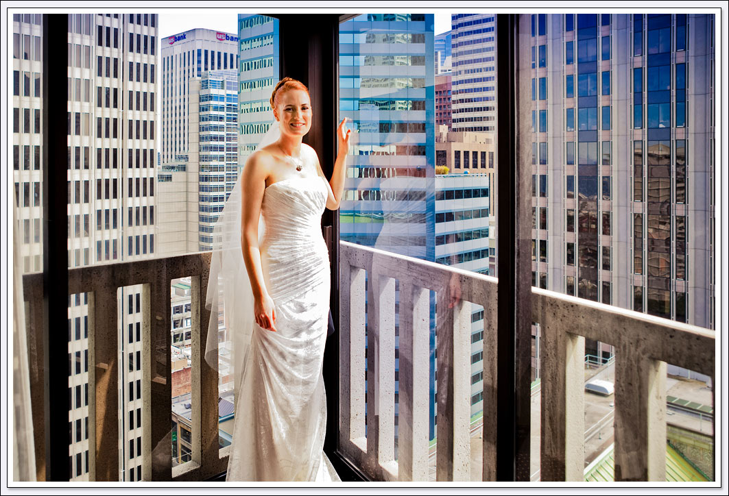 The San Francisco skyline 16 floors up serves as the backdrop for this bridal portrait.