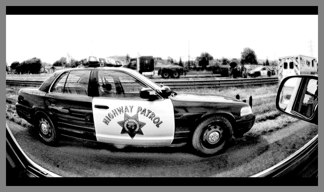 California Highway patrol car parked at accident scene - Black and White HDR conversion.