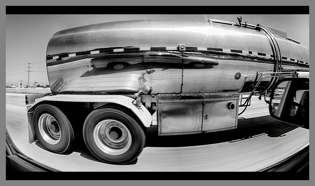 Reflection in stainless steel tanker truck on Highway 4 in Antioch, CA converted in HDR to black and white.