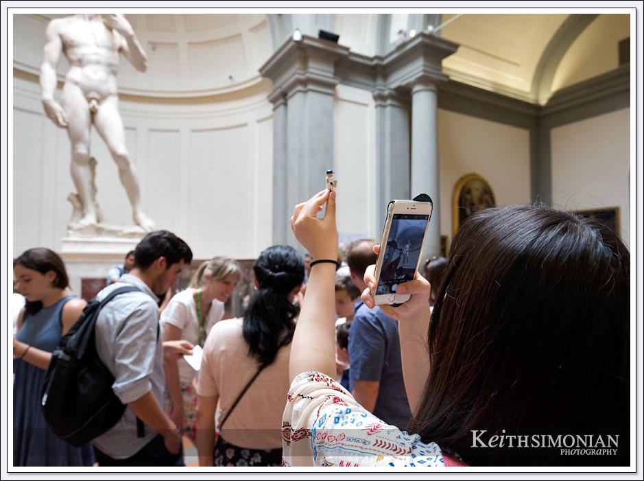 Tourist taking photo of Michelangelo's David - Florence Italy