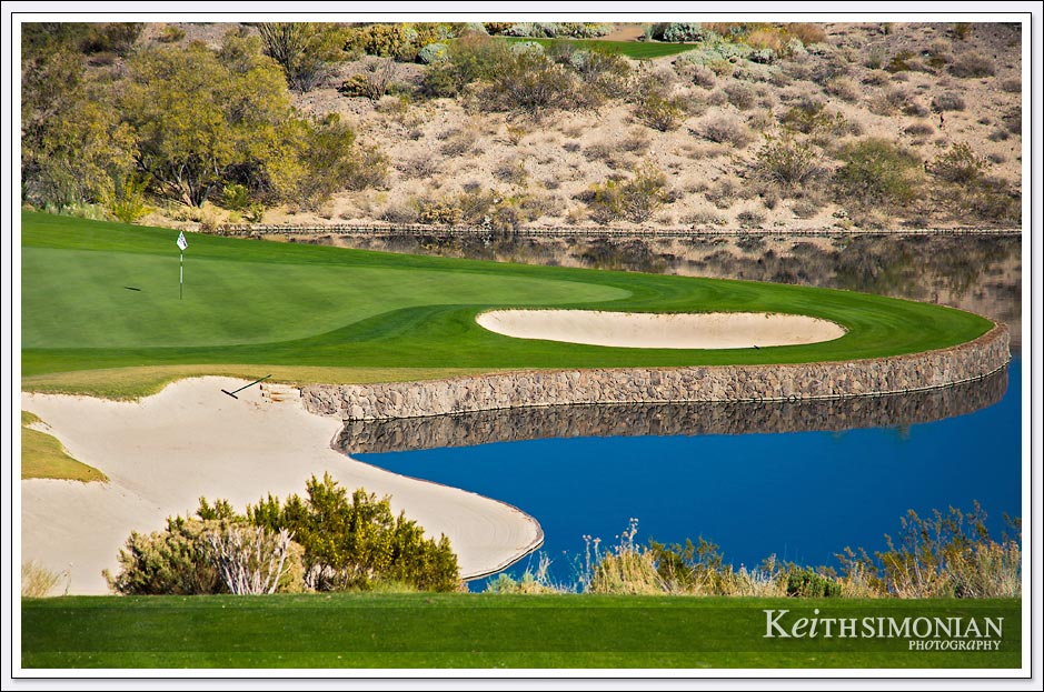 Green surrounded by water on the Wickenburg Ranch Golf course. 