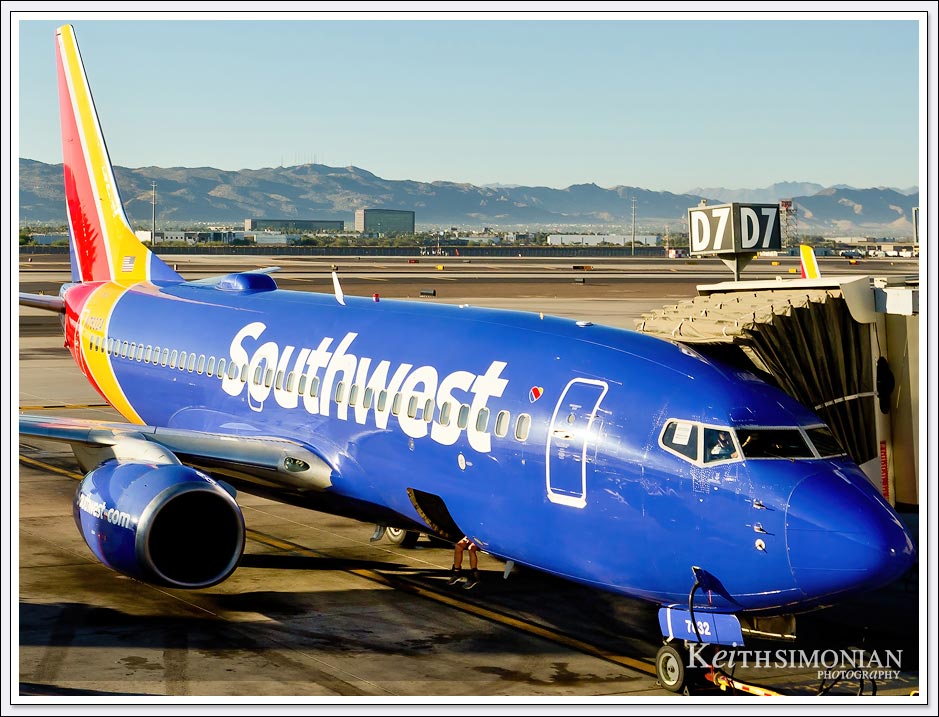 Southwest Airlines blue jet with luggage compartment open in Phoenix, Arizona. 