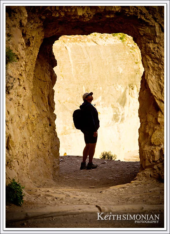 A hiker checks out the "hole in the wall" on the Bright Angel Trail - Grand Canyon - Arizona