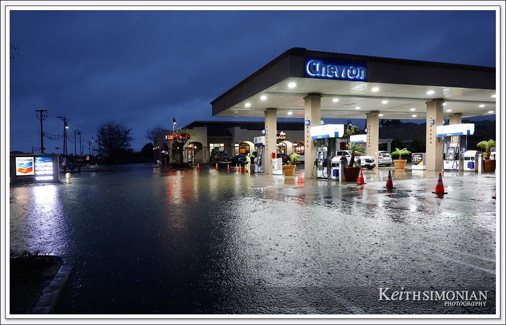 The record breaking rainfall caused the intersection flooding to spill into the Chevron gas station - Brentwood, CA.