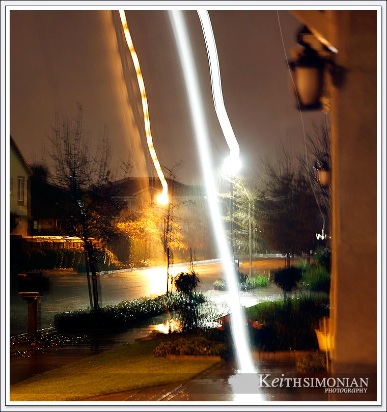 Street lights during a California winter storm look like death rays from space due to camera movement.